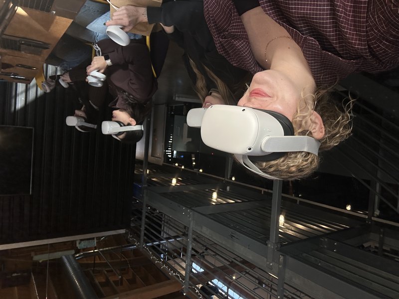 Participants wearing Meta Quest headsets during a moderated session